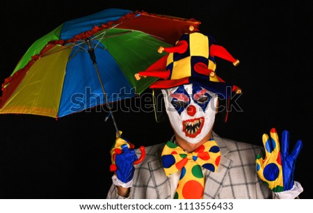 evil clown on a black background