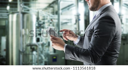 Engineer hand using tablet