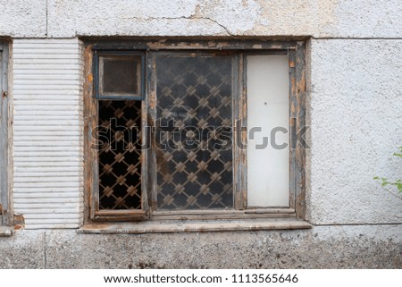 Old window with beaten windows