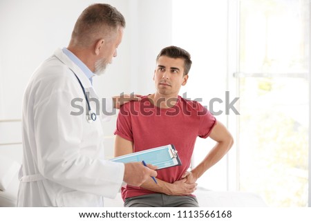 Man with health problem visiting urologist at hospital Royalty-Free Stock Photo #1113566168