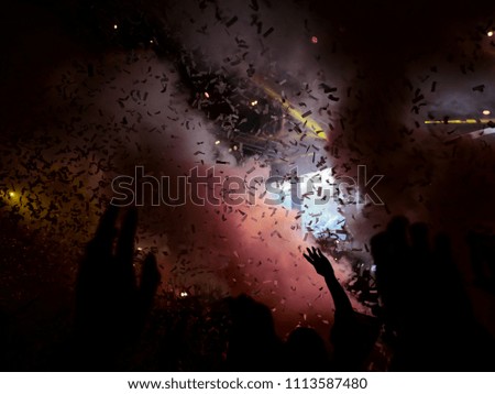 Live concert lights, smoke and confetti finale