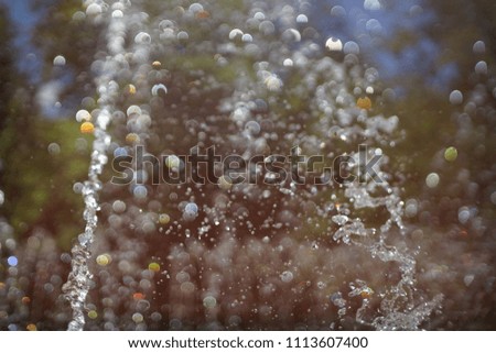 The gush of water of a fountain. Splash of water in the fountain, abstract image.
