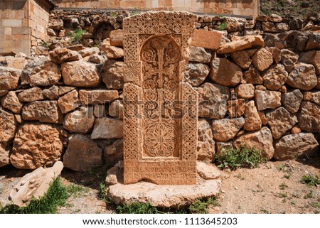Armenian stone carved cross, khachkar. An ancient religious symbol. Christian art object.