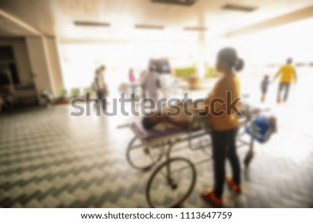 Medical team moving patient in the hospital blurred.