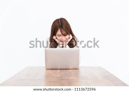Beautiful young asian businesswoman using laptop