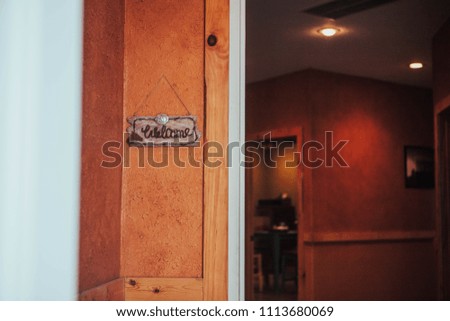 Rustic "Welcome" Sign at Entry way of Cabin