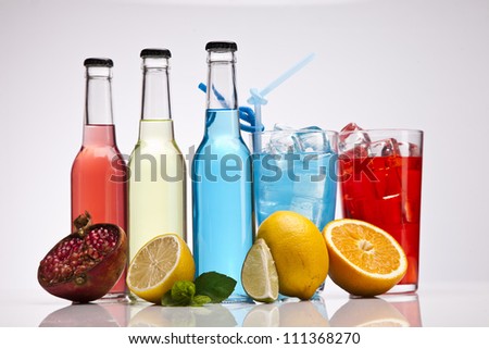 Exotic bottle alcohol cocktail isolated on white