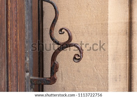 church brown wooden door with handles details at historical city south germany