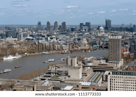 Aerial view of cityscape and skyline of London with the Thames, a major river that flows through southern England, most notably through London, United Kingdom