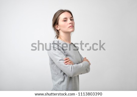 The young woman portrait with proud and arrogant emotions on face. She is self proud and does not care about other people Royalty-Free Stock Photo #1113803390