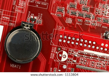 A motherboard close up showing the battery and some circuits