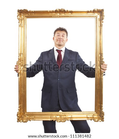Portrait of businessman holding a golden frame on white background