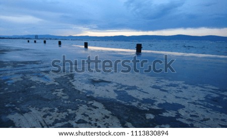 dark blue weather clouds sea landscape seascape pier