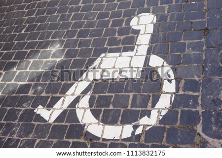    Universal Sign for Handicap Parking Spot. wheelchair with information sign on floor background for disable                                                            