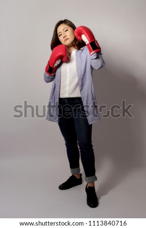 The Asian woman with glove on the white background.