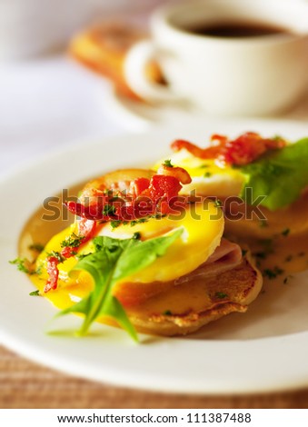 Photo of morning food, image of fried delicious egg with green salad and slice ham, picture of fresh breakfast with cup of tea, white plate with scrambled and mug of coffee, food closeup still life