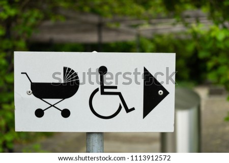 baby stroller and wheelchair sign direction