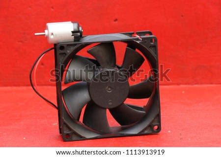 cpu cooler also called as pc cooling fan with red background