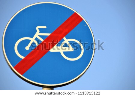 men and women, bicycle street sign