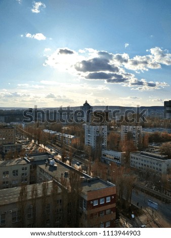 Saratov, Russia. Top view of cityscape. Urban landscape. Fantastic sunny sky with clouds at sunset.