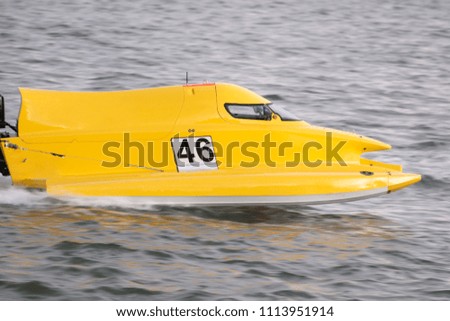 Fast powerboat racing on a river in Portimao, Portugal.