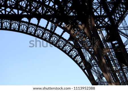 Close Up Detail of Steel Framework of Eiffel Tower with A Blue Sky, The Famous French Symbol in Paris, France.
