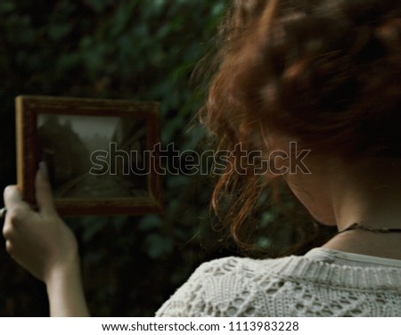 Irish redhead girl lost in the forest with photo of parents house in Galway