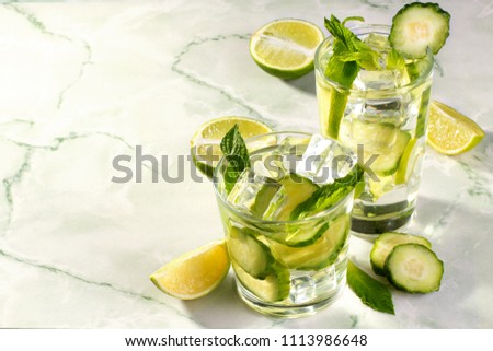 Fresh cucumber water with lime and basil