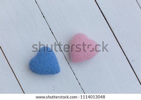 hearts on white background. pink and blue heart. hearts made of wool made by hand