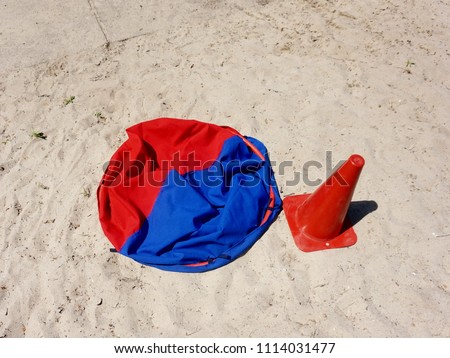 Sports equipment, prepared for competitions, lying on the sand.