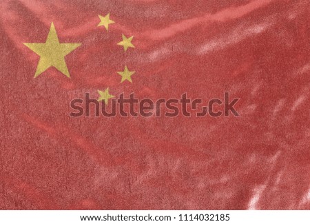 China flag on fabric background texture close up ..