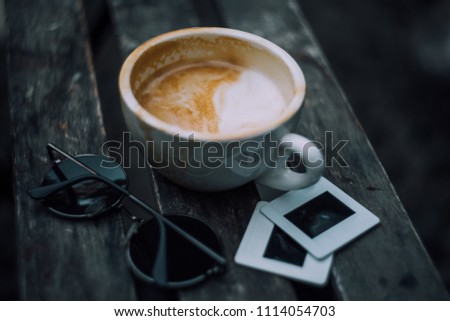 cup fo latte art on wooden background