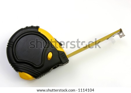 Measuring tape on its side and over view over a white background