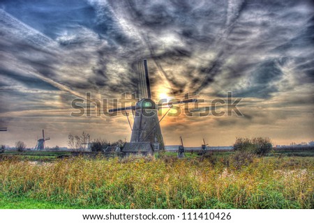 Countryside-style is a special characteristic for this picture, old-fashion windmill stand in a row and during the lazy afternoon, make it as a storybook.