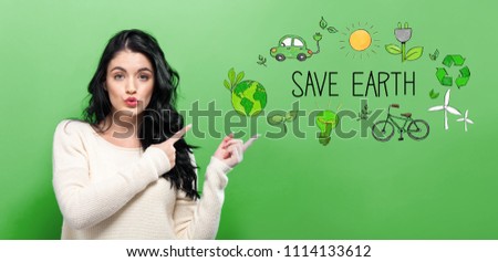 Save Earth with young woman on a green background