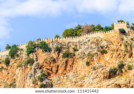 Fragment of the wall of an old fortress. Photo wall on top of a mountain