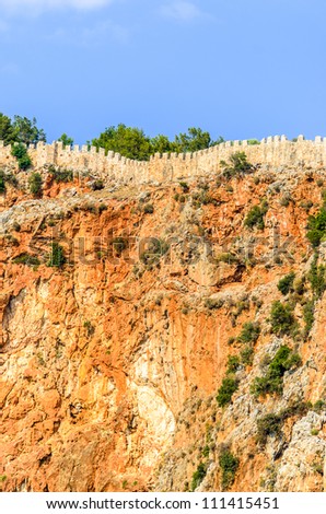 Fragment of the wall of an old fortress. Photo wall on top of a mountain