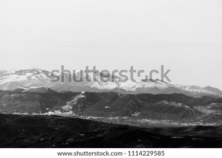Umbria valley in winter, with a view of Gubbio town with big, li