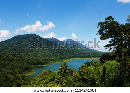 Wonderful view of mountain with Batur lake in sunny day at Bali, Indonesia.