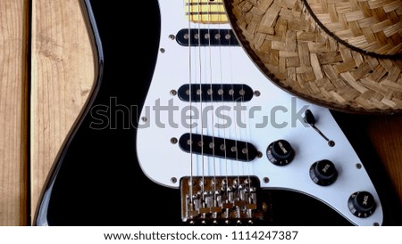 guitar electric and cowboy hat