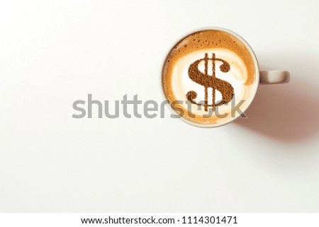 cup of cappuccino with a picture of a dollar Royalty-Free Stock Photo #1114301471