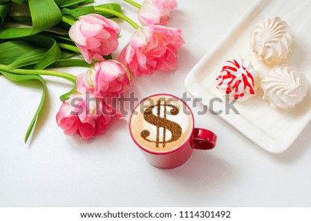 cup of cappuccino with a picture of a dollar