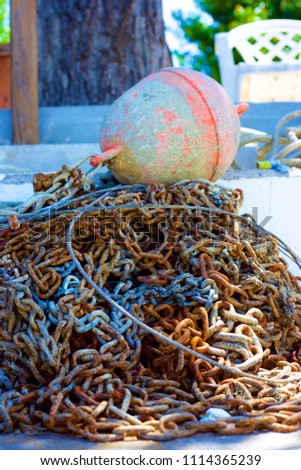 chains for a fishing net on the lake