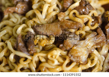 Stir fried instant noodle with mixed ingredient.