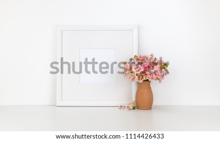 Square frame mockup on white background, flowers