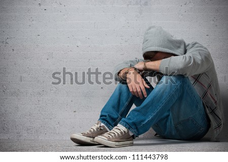 Arrested teenager with handcuffs on his hands Royalty-Free Stock Photo #111443798