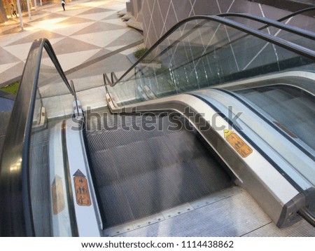 going down by escalator