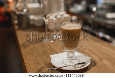 Cup of hot coffee in café