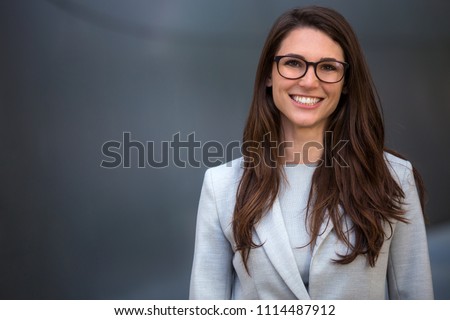 Warm likable commercial friendly portrait of a smart beautiful natural woman, business executive person Royalty-Free Stock Photo #1114487912
