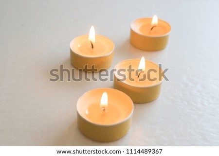 aromatic apple candles lit with a warm flame